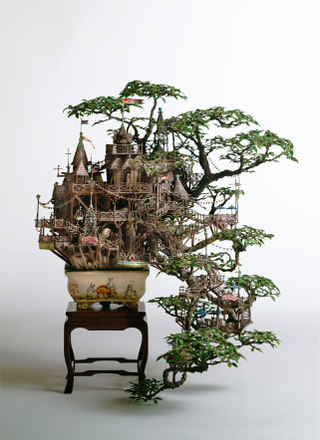 Illustration for article titled Artist transforms bonsai trees and empty cans into insane Lilliputian cities